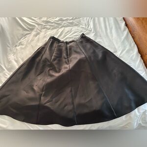 NWOT black midi length satin skirt